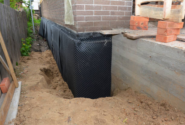 SJ Waterproofing Pros technician performing targeted Basement Waterproofing assessment in Hoagland, IN